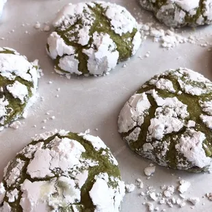  plate of cookies covered in powdered sugar