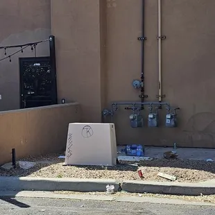  broken toilet outside a building