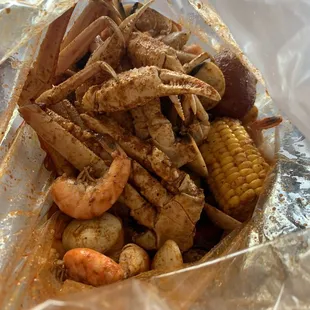 Snow crab, headless shrimp, clams, potato, corn. Medium heat crackin sauce