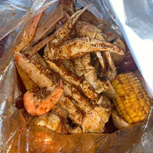 Snow crab, headless shrimp, clams, potato, corn. Medium heat crackin sauce