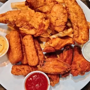 Sampler Platter Old bay wings, mozzarella sticks, chicken strips (not seasoned at all) and French fries