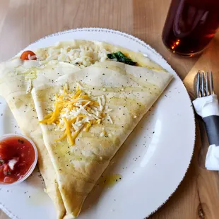 Crepe with potatoes, tomatoes, spinach, and cheese