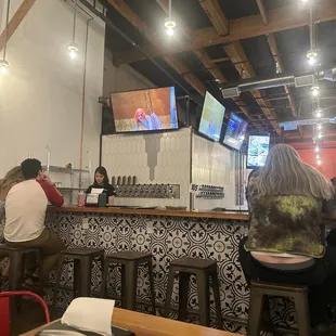 people sitting at a bar