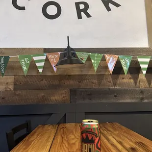 a can of craft and cork on a table