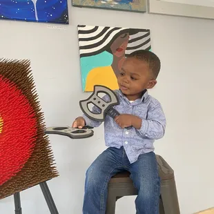 Kid friendly axe throwing and local art for sale