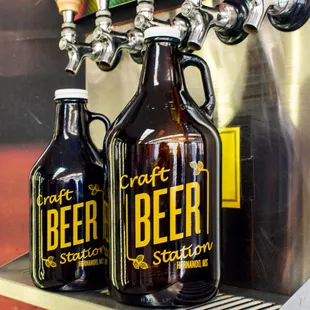 two beer bottles on a shelf