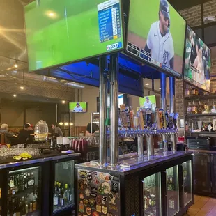 a bar with a large screen tv