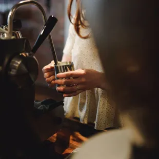 Barista making a latte