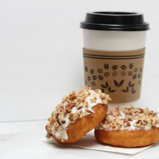 two donuts and a cup of coffee