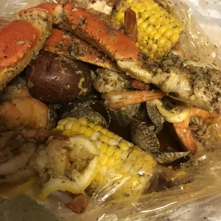 Seafood boil in a bag; Lobster, snow crab, shrimp and added clams, corn and potatoes, Lemon pepper seasoning.