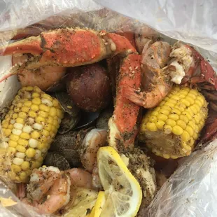 Seafood boil in a bag; Lobster, snow crab, shrimp and added clams, corn and potatoes, Lemon pepper seasoning.