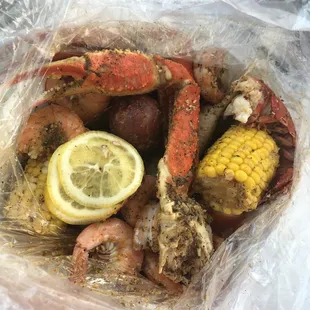 Seafood boil in a bag; Lobster, snow crab, shrimp and added clams, corn and potatoes, Lemon pepper seasoning.