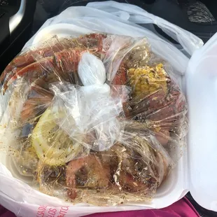 Seafood boil in a bag; Lobster, snow crab, shrimp and added clams, corn and potatoes, Lemon pepper seasoning.