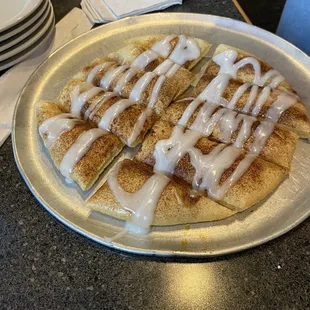 a pancake with a drizzle of icing on top