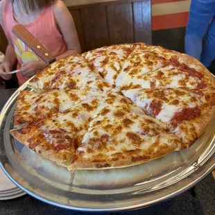 a pizza on a serving platter