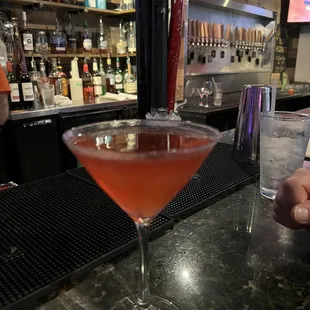 a cocktail in a martini glass