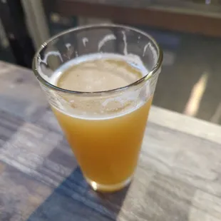 a glass of beer on a table