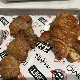 Breakfast crescent sandwich - bacon, egg &amp; cheese. With side of smashed toasted potatoes