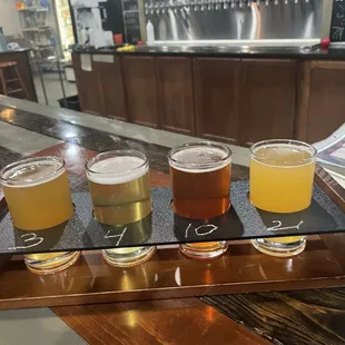 Beer flight inside Craft Life Brewery - Blond lager, Hefeweizen, red ale, hazy IPA