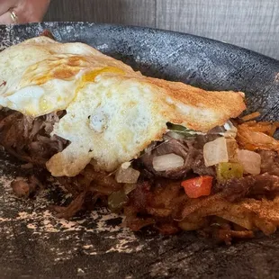 Short rib hash with over easy eggs