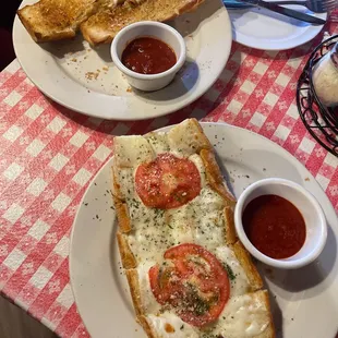 Garlic bread with cheese and tomatoes
