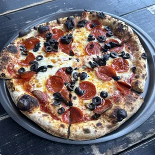 Pepperoni pizza with black olives