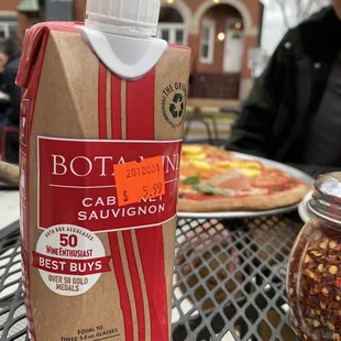 a carton of tomato sauce sitting on a table