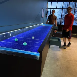 two men playing a game of table tennis