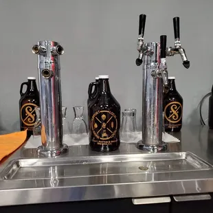 a row of beer taps