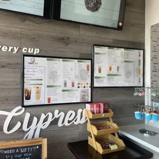 a coffee shop with menus on the wall