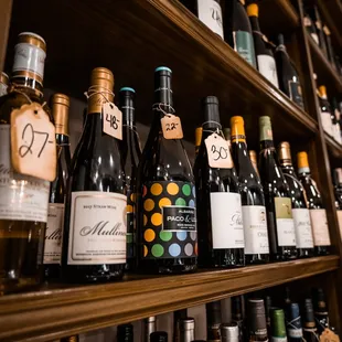 a shelf full of wine bottles