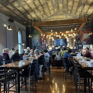 The main eating area. This location was originally a church. The ceiling and woodwork is incredible...very well done.