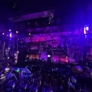 a bar filled with bottles of alcohol