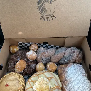 a variety of doughnuts in a box