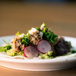 a plate of food on a wooden table