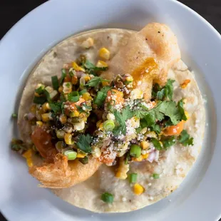 a taco on a plate on a table