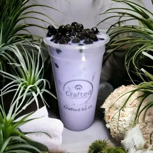 a purple drink with blackberries in it