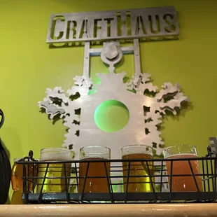 a row of beer glasses on a bar