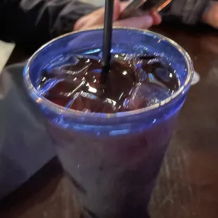 a close up of a drink in a plastic cup