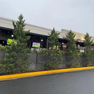 the outside of a crafthouse on a rainy day