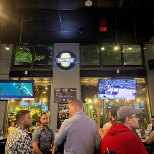 a group of people sitting at a bar