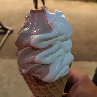 hand holding ice cream cone