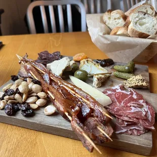 a platter of meats and breads