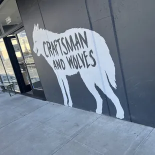 a goat on the side of a building