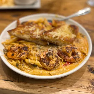 Cajun Shrimp Pasta - 5/5 Excellent, full of flavor. Mild spicy. Served with garlic bread
