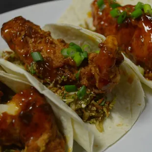 Asian Chicken Tacos- Crispy Fried Chicken Tossed in Thai Chili Sauce on a Bed of Homemade Asian Slaw, on Warm Flour Tortillas