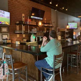 a man sitting at a bar