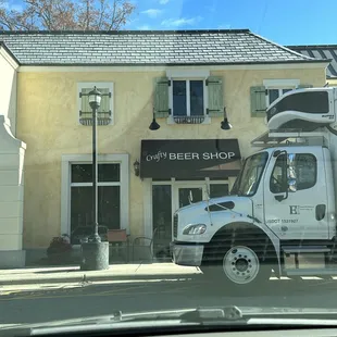 a truck parked in front of a building