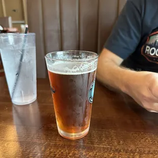 a glass of beer on a table