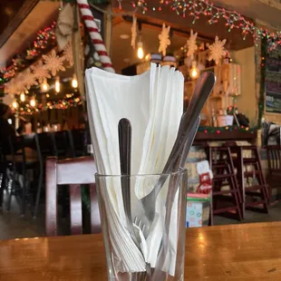 a glass full of utensils